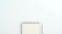 Open spiral notebook with blank cream pages on white background, isolated and ready for design use on stationery, education, and office projects.