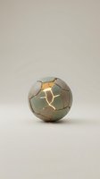 Cracked ceramic sphere with warm golden light glowing through fractured segments, isolated on neutral background. Suitable for design, art direction, and creative projects.