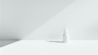 Minimalist white cosmetic bottle casting soft shadow on white surface. Clean, modern composition for beauty and skincare product photography.