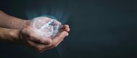 Caucasian male hand holding glowing digital globe with network connections, representing global technology, data transfer, and worldwide business communication concepts.