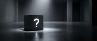 Black cube with white question mark symbol illuminated by dramatic spotlight in dark empty room creating mystery and uncertainty atmosphere.