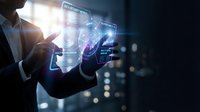 Businessman using futuristic holographic interface with digital data analytics and virtual technology displays in modern office environment.