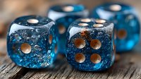 Transparent blue dice with bubbles and copper dots on wooden surface in macro photography, showing gaming equipment details and texture.