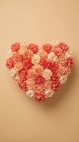 Heart-shaped arrangement of coral and cream carnations on beige background for Valentine's Day, wedding, anniversary, and romantic celebration designs.