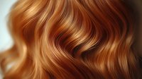 Close-up of wavy auburn hair with golden highlights showing natural texture and shine, ideal for beauty, haircare, and salon advertising.