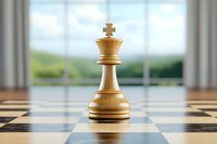White wooden king chess piece standing alone on checkered board with blurred background, dramatic lighting highlights strategy and leadership concept.