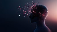 Male profile silhouette with glowing particles dispersing from head against dark background, representing mental health, consciousness and mind transformation.