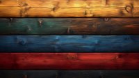 Rustic wooden planks in orange, blue and red tones create textured horizontal stripes pattern. Natural wood grain and knots add authentic vintage character. Background for design.