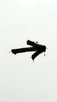 Black paint brush stroke arrow pointing right on white isolated background, ready for graphic design, web, and marketing materials.