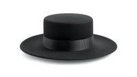 Black Spanish style flat crown hat with wide brim and grosgrain ribbon band on white background, isolated fashion accessory for design projects.