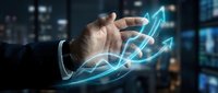 Businessman hand holding glowing blue growth arrows in modern office environment representing business success and financial progress upward trend.