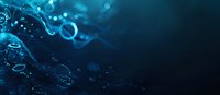 Glowing blue particles and bubbles floating in dark underwater space create mesmerizing abstract background with bokeh effect and light trails for science designs.