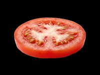 Fresh red tomato slice with seeds and juicy flesh, isolated on transparent background. Ready for food packaging, stickers, t-shirt design, clipart, and print on demand use.