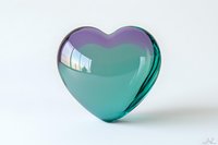 Translucent turquoise glass heart with purple highlights on white background, isolated decorative love symbol suitable for romantic designs and valentines concepts.