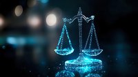 Digital glowing scales of justice with blue light effect on dark background, symbolizing law, technology and modern jurisprudence concepts.
