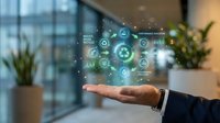 Digital technology icons floating above open palm of professional in modern office workspace with city skyline view and plants.