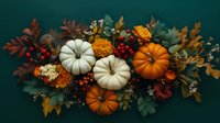 Festive autumn arrangement with white and orange pumpkins, marigolds, red berries, and eucalyptus leaves on dark green background, seasonal holiday decor.