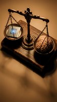 Vintage brass scales weighing human brain against computer processor chip on old books, symbolizing artificial intelligence versus human intelligence balance.