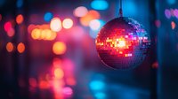Sparkling disco ball with colorful bokeh lights creating vibrant nightclub atmosphere for party and entertainment venues.