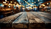 Rustic wooden table surface with warm bokeh lights creating cozy atmosphere for product display and food photography backgrounds.