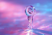 Crystal clear key on reflective surface against dreamy pink and blue sky background with soft bokeh lights, symbolizing success and opportunity.