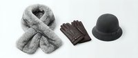 Gray knitted scarf with leather gloves and black hat isolated on white background. Winter fashion accessories set for cold weather styling and design.