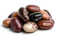Mixed dried beans in various shades of brown and red on white background, macro food photography showing natural texture and glossy surface of legumes.