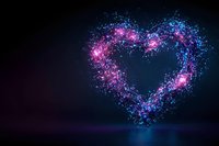 Glowing heart shape formed by luminous pink and blue particles against dark background, creating magical light effect with sparkles and bokeh elements.