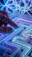 Hand touching illuminated control panel with neon blue and purple lights, representing technology, innovation, and digital interface interaction for futuristic design projects.