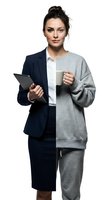Young businesswoman split between professional suit and casual wear holding tablet and coffee mug on white background isolated for design use.