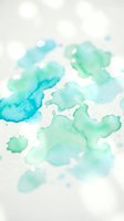 Abstract watercolor background with turquoise and teal paint splashes on white paper. Artistic fluid texture for creative projects and design elements.