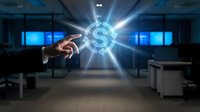 Businessman hand pointing at glowing dollar sign symbol with light rays in modern office space for financial success and investment concepts.