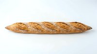 Crusty whole grain baguette with diagonal scoring marks isolated on white background, ready for bakery, food, and culinary design use.
