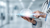 Doctor using digital tablet with brain hologram and heartbeat line for medical technology and healthcare innovation in hospital setting.
