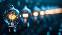 Glowing light bulb with warm filament against dark blue bokeh background, symbolizing innovation, creativity and bright ideas in business concept.