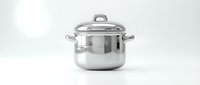 Stainless steel cooking pot with lid and handles isolated on white background, ready for kitchen and culinary design use.