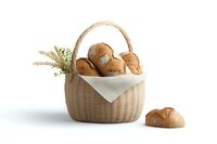 Fresh bread rolls in woven basket with white napkin and wheat stalks on white background, one roll placed separately, isolated food photography.