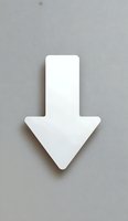 White downward pointing arrow symbol isolated on gray background, minimalist design element for navigation and direction indicators.