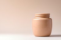 Minimalist ceramic jar on beige background with soft shadows and textured matte finish, modern pottery design for sustainable lifestyle and home decor.