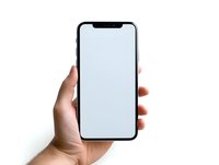 Female hand holding modern smartphone with blank white screen isolated on white background, mockup for app or web design presentation.