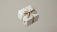 White gift box with elegant golden ribbon bow floating on beige background, perfect for holiday, birthday, and luxury packaging concepts.