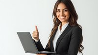 Young Hispanic businesswoman in black suit showing thumbs up while working on laptop computer against white background, positive workplace attitude.