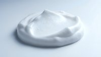 Whipped white cream or foam texture isolated on white background, ready for cosmetic, skincare, dairy product, or food packaging design mockups.