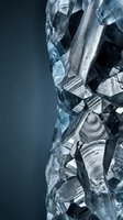 Shattered glass fragments with sharp edges and reflective surfaces creating dramatic light patterns on dark background for design projects.