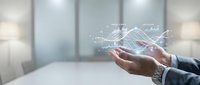 Businessman hand holding holographic digital network connections and data analytics in modern office environment for technology presentations.