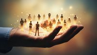 Business hand holding diverse team silhouettes with golden light, representing leadership, human resources management, and corporate talent development.
