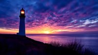 Lighthouse silhouette against dramatic purple and orange sunset sky over ocean horizon, illuminated beacon light glowing in twilight with coastal grass in foreground.