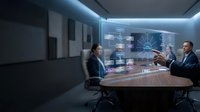 Business professionals analyzing holographic data visualization in modern conference room with futuristic technology interface for strategic planning.