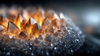 Glowing orange crystal formation in dark background with selective focus, showing natural mineral structure and geometric patterns in macro photography.