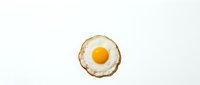 Fried egg with golden yolk isolated on white background for breakfast menu design and culinary projects.